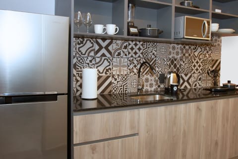 Mini-fridge, microwave, stovetop, electric kettle