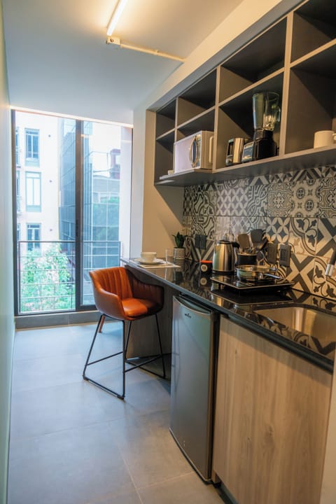 Standard Studio | Premium bedding, desk, laptop workspace, blackout drapes