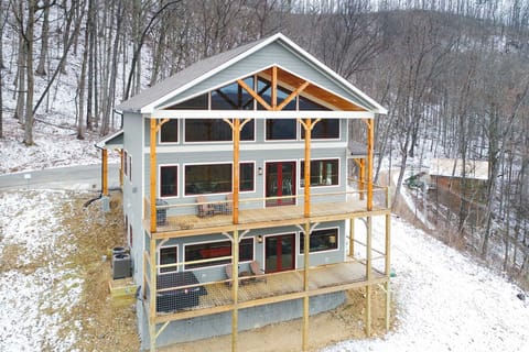 Snowy shot of the back of the cabin!
