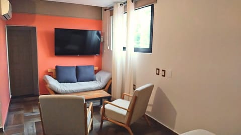 Elite Room | Living area | 50-inch flat-screen TV with digital channels