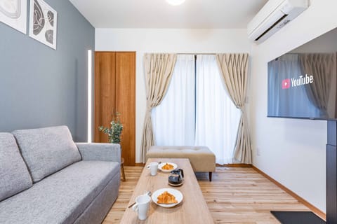 Design House | Living area | Flat-screen TV