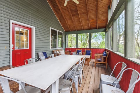 Large screen porch with seating and dining perfect for evening meals or morning coffee
