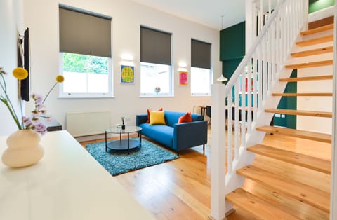 Large Mezzanine Studio Apartment | Living area | Flat-screen TV