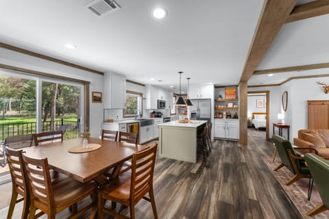 The kitchen features all the cooking necessities, a coffee bar and a bar area.