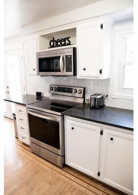 A clean flat top range with oven is available. There is also a toaster.