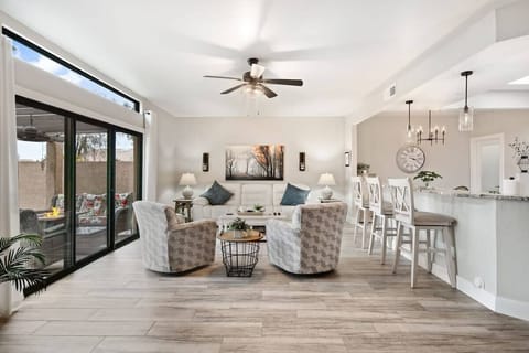 Spacous living room with sliding glass windows leading out to the patio.
