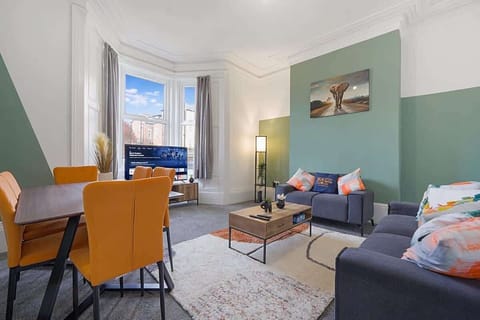 Spacious open-plan living room and a dining area, benefits from a Smart TV with Netflix and other streaming platform, a 6-seater dining table and a plenty to sit down and relax. 