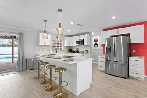 Beautifully Remolded Kitchen with Quartz Countertops and SS Appliances