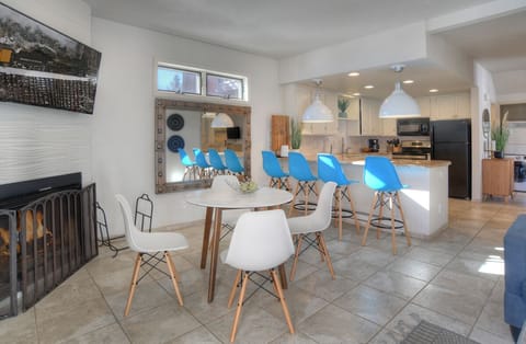 Dining Space with Fireplace, Smart TV, Breakfast Bar and Open Views of the Kitchen and Living Room - Seating for four (4) at the Dining Table & Seating for Four (4) at the Breakfast Bar