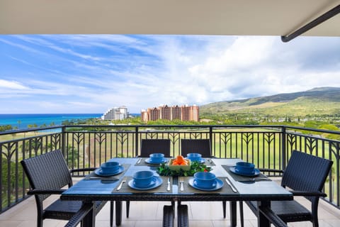 Savor breakfast on your private balcony with stunning ocean views, mountains, and resort scenery stretching to the horizon.