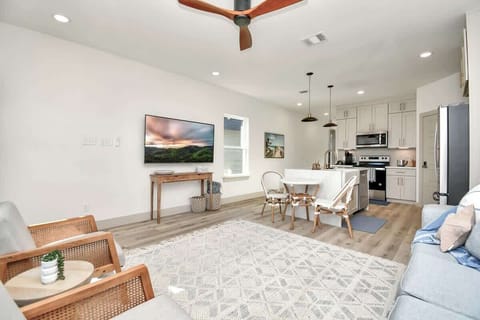 The open concept of the family room creates an environment perfect for  relaxation, socializing, and entertaining.