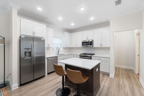 Fully equipped kitchen with all cooking and baking supplies, gas stove, and dishwasher. Kids dishes available.Dining area seats 6 with 4 at the table and 2 at kitchen island. Regular drip coffee maker. We provide filters.