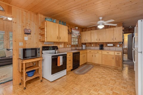 An open concept kitchen area equipped with everything needed to prepare a meal.