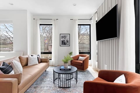 Spacious Living Room with Elegant Décor and Natural Light
