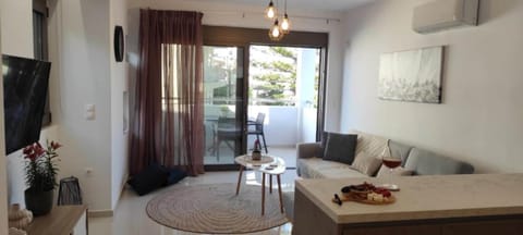 Deluxe Apartment | Living room | 42-inch Smart TV with digital channels, Netflix, streaming services