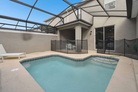 Discover your private oasis with a sparkling pool enclosed for your safety, ideal for soaking up the sun. Relax on soft lounge chairs and enjoy the refreshing ambiance created by clean, modern lines.