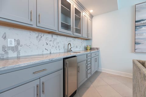 Grab a chilled drink from the fridge or create your favorite cocktail at the wet bar