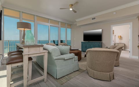 Gather in this welcoming living space and enjoy stunning panoramic beach views through the windows