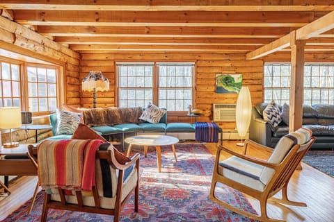 This sofa and chairs are parallel to the indoor wood stove