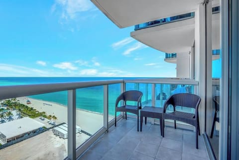 Breathtaking balcony views of the pristine beach and endless sea.
