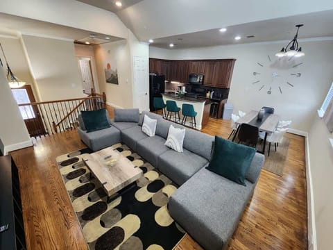 Modern open-plan living area ideal for conversation and movie nights.