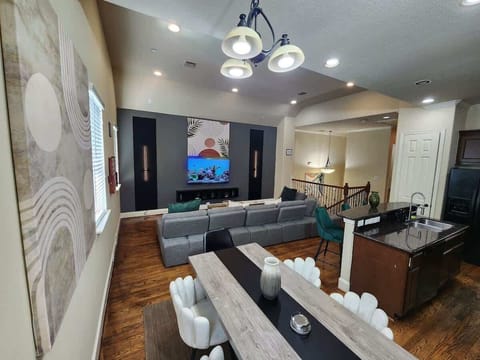 Spacious living room filled with light and cozy modern decor.