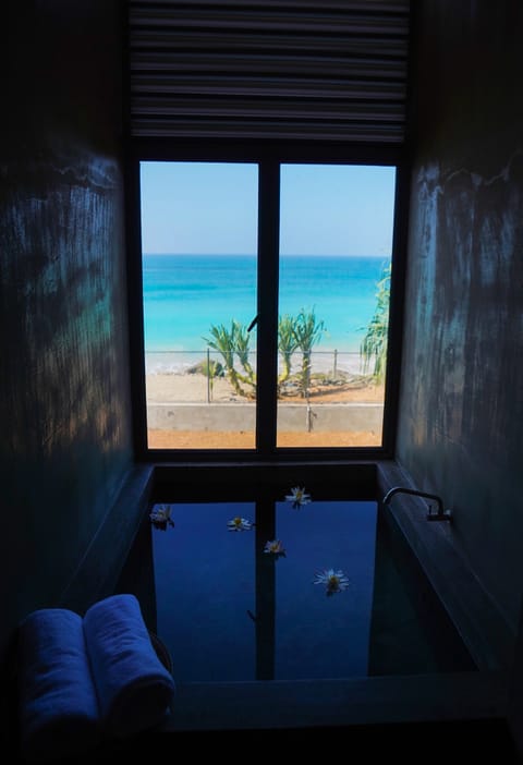 Luxury Studio Suite, 1 King Bed, Ocean View, Oceanfront | Bathroom | Combined shower/tub, rainfall showerhead, hair dryer, bathrobes