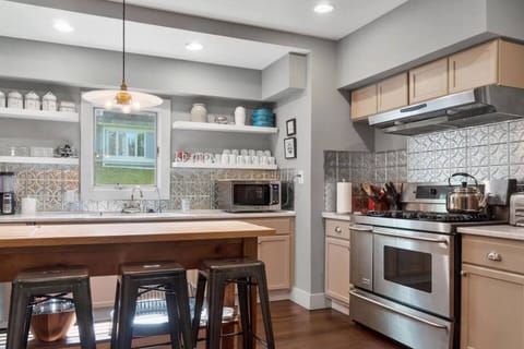 Kitchen includes 4 stools that pull up to the butcher block counter.