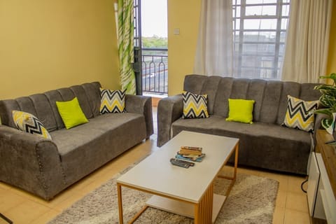 Comfort Apartment | Living area | 24-inch Smart TV with digital channels