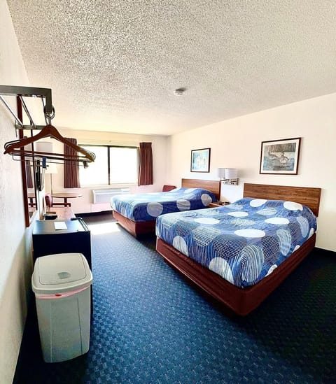 Cozy 2 Queen room with two queen beds, a mini fridge, and single-serve coffee maker—perfect for a comfortable Northwoods stay.