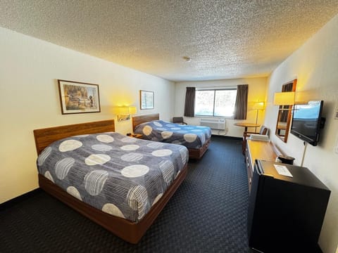 Cozy 2 Queen room with two queen beds, a mini fridge, and single-serve coffee maker—perfect for a comfortable Northwoods stay.
