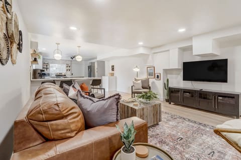 Experience spacious comfort in our living room, complete with a cozy sofa and a hanging chair for a touch of relaxation. Stylish, inviting, and designed for your ultimate comfort.