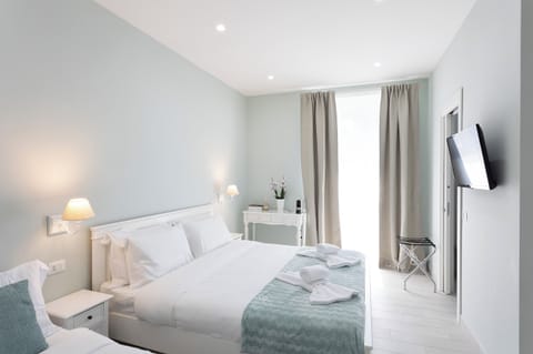 Superior Quadruple Room, 1 Bedroom, Non Smoking, City View | Premium bedding, down comforters, pillowtop beds, free minibar