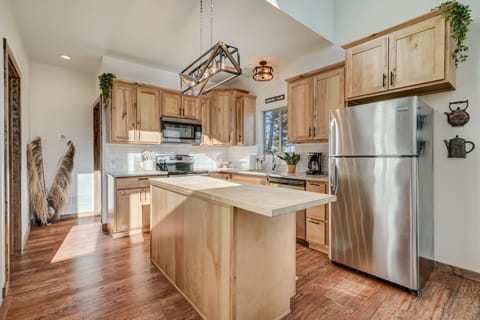 The new kitchen features a beautiful center island and has everything you need to prepare meals together.