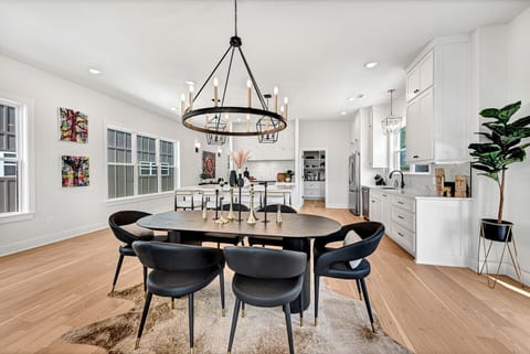 Dining area for 10 people. Table and oversized island seating at the counter.