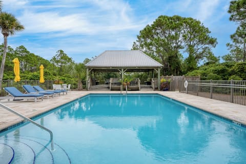 Access to community pool, hot tub, and shaded cabana.