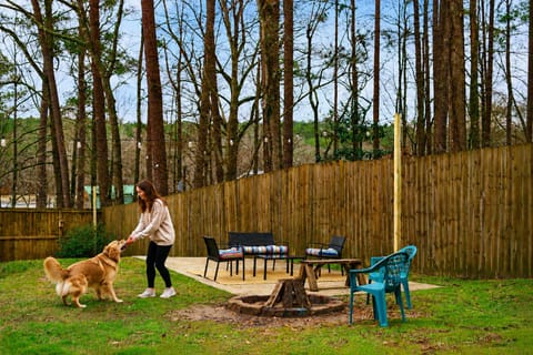 Bring the dog and let them off the leash — the whole backyard's fenced, with a fire pit, string lights, and room to run, all to yourselves.