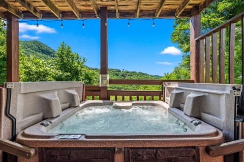 Relax in the hot tub overlooking beautiful mountain views.