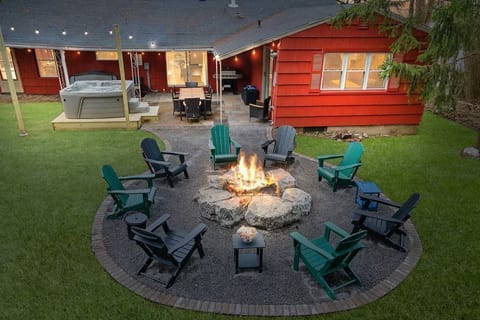 The ultimate getaway! Relax around the fire with eight comfortable ADK chairs.