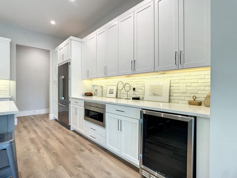 Our open kitchen with a generous island invites you to create, connect, and indulge in the comforts of home.