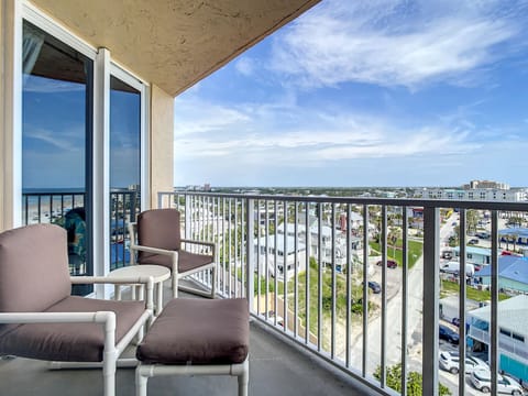 Enjoy panoramic views of the ocean and neighborhood from this comfortable balcony.