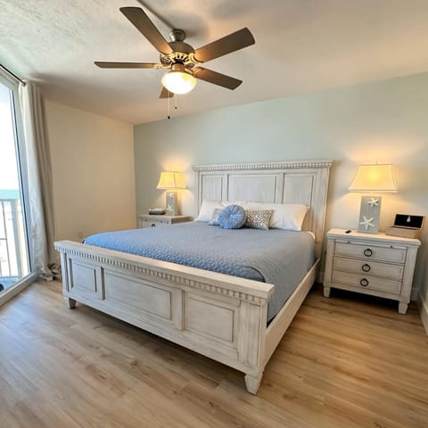 Unwind in this elegant beachside bedroom featuring soft tones, plush bedding, and private balcony access. Perfect for restful nights with ocean breezes and the calming sound of waves nearby.