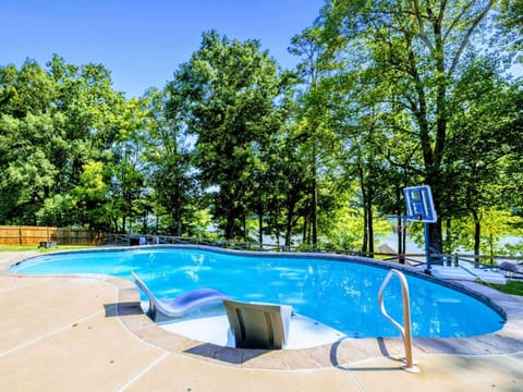 Pool - A private pool with basketball hoop and loungers, tucked into the fenced backyard for all-day fun.