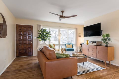 Bright, stylish living room with cozy seating, smart TV, and natural light…perfect for relaxing after a long day.