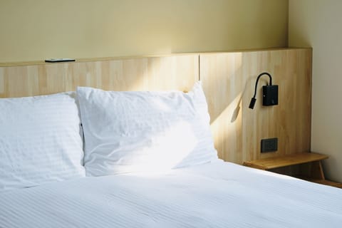 Basic Double Room | Premium bedding, down comforters, laptop workspace, free WiFi