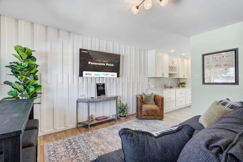 Our living room features a large and flat-screen TV, soft lighting, plush seating and unique and interesting decor pieces, adding character and charm to the space.