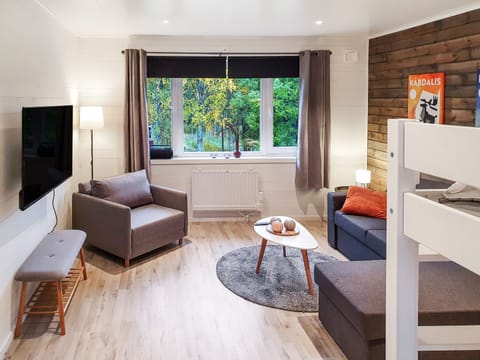 Comfort Apartment | Living area | Flat-screen TV, heated floors