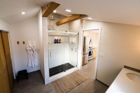 Custom Italian tile shower w/rainfall head and dual side jets for immersive bath