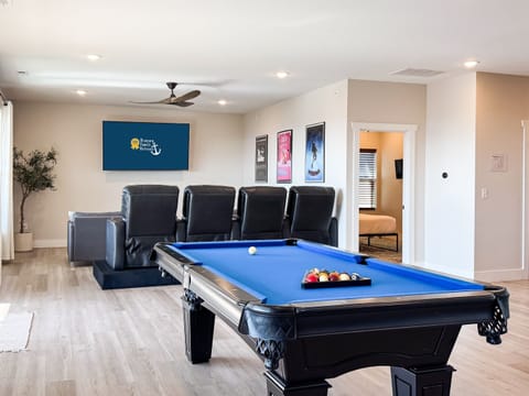 Theater and game room with access to 2nd level deck