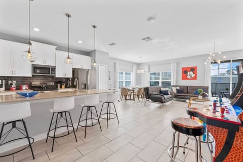 Open Layout blends kitchen, living room and dining room!#Disney #Parks #kingdom #springs #Vacation #Rental #waterpark #davenport #Kissimmee #Orlando #universal #citywalk #legoland #shortstay #longstay #championsgate #resort #golf #oasisclub